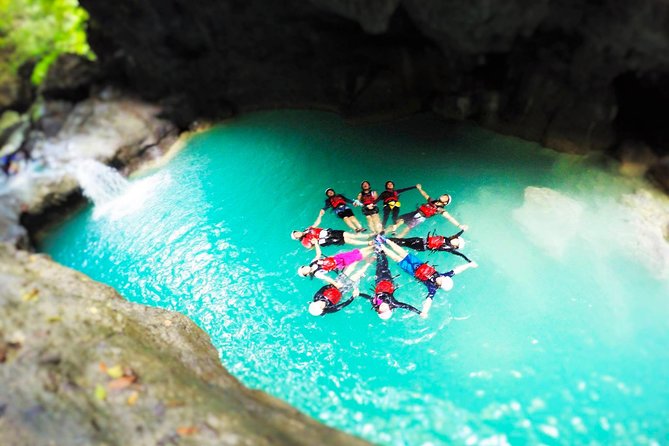 Canyoneering in Kawasan Badian Tour with Lunch & Transportation - Reaching Kawasan Falls after four hours in the canyon