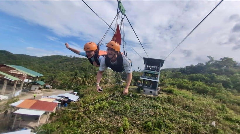 Cebu: Kawasan Canyoneering with Ziplining Adventure - The zipline above the tropical scenery