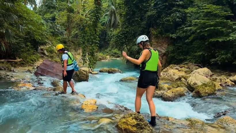 Cebu: Kawasan Falls Canyoneering Tour with Ziplining & Lunch - Ambak Base Camp lunch with a sea view