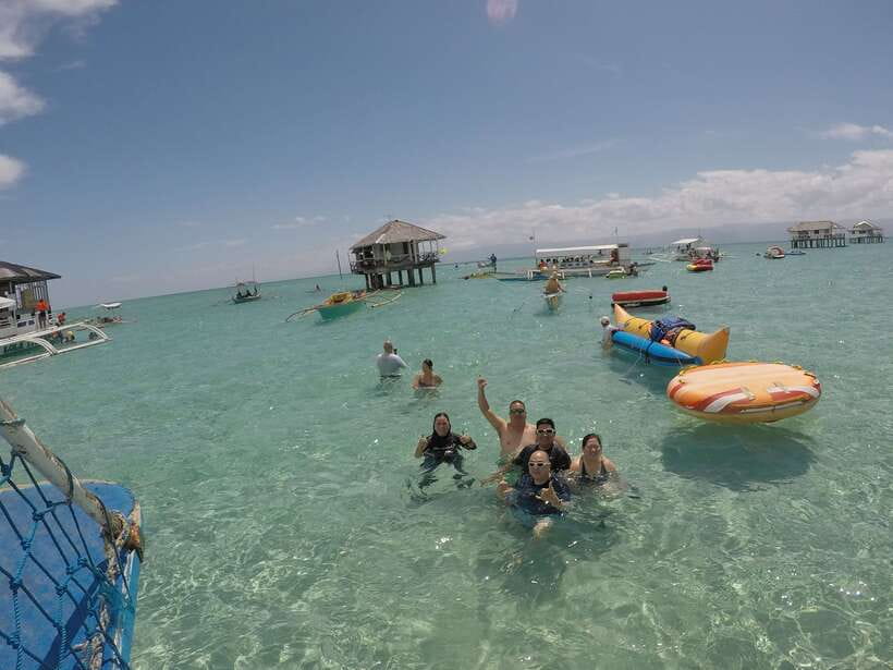 Dumaguete: Dolphin Watching & Manjuyod Sandbar Private Tour - Riding a banca boat toward Bais Bay