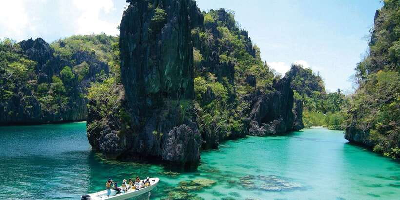 El Nido: Island Hopping Tour A Lagoons and Beaches - Seven Commandos Beach: palms, sand, and downtime