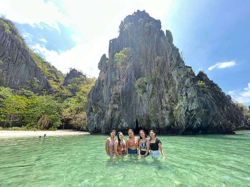 El Nido: Shared Island Hopping Tour C with Buffet Lunch - Helicopter Island starts the day with coral and cliffs