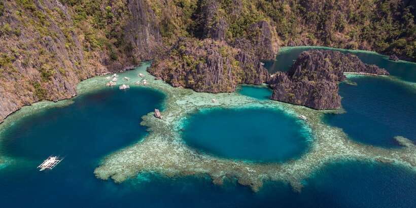 From Coron: Island Hopping Boat Day Trip with Buffet Lunch - A hot buffet lunch on the beach