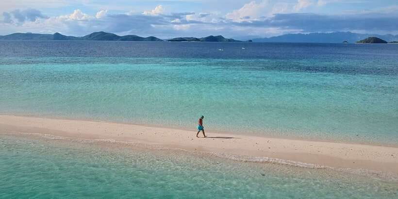 From Coron: Private Island-Hopping Cruise with Lunch - Banana Island for sand and nearby coral