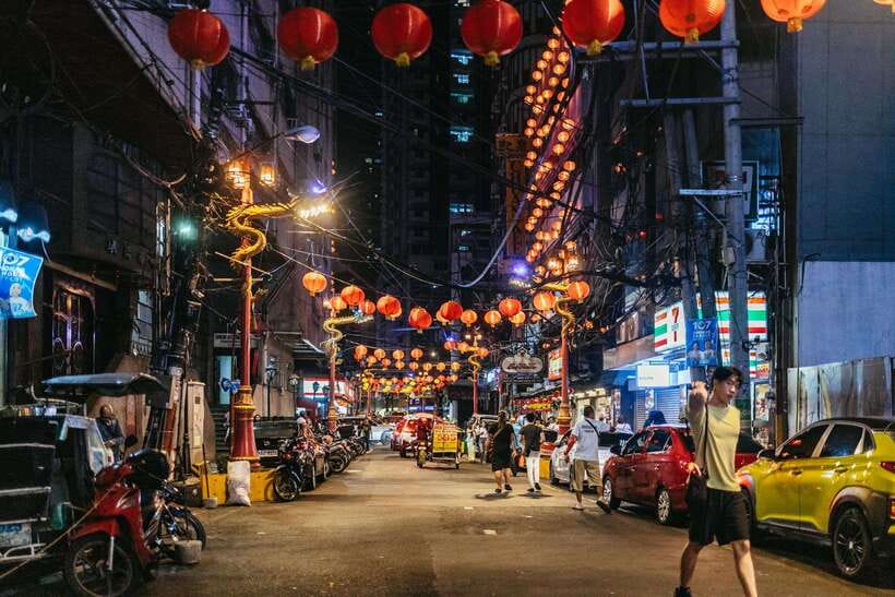 Manila: Guided Night Market Experience - A rooftop finish and street entertainment