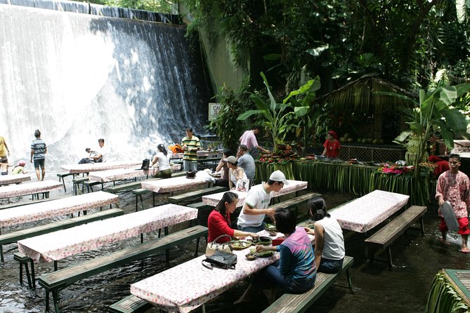 Villa Escudero Coconut Plantation Day Trip from Manila - Riding behind a Filipino carabao